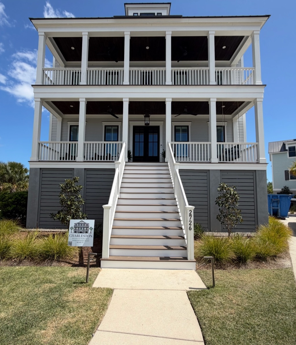 Coastal Charleston home with double porches and a wide central staircase built by Charleston Decks and Porches
